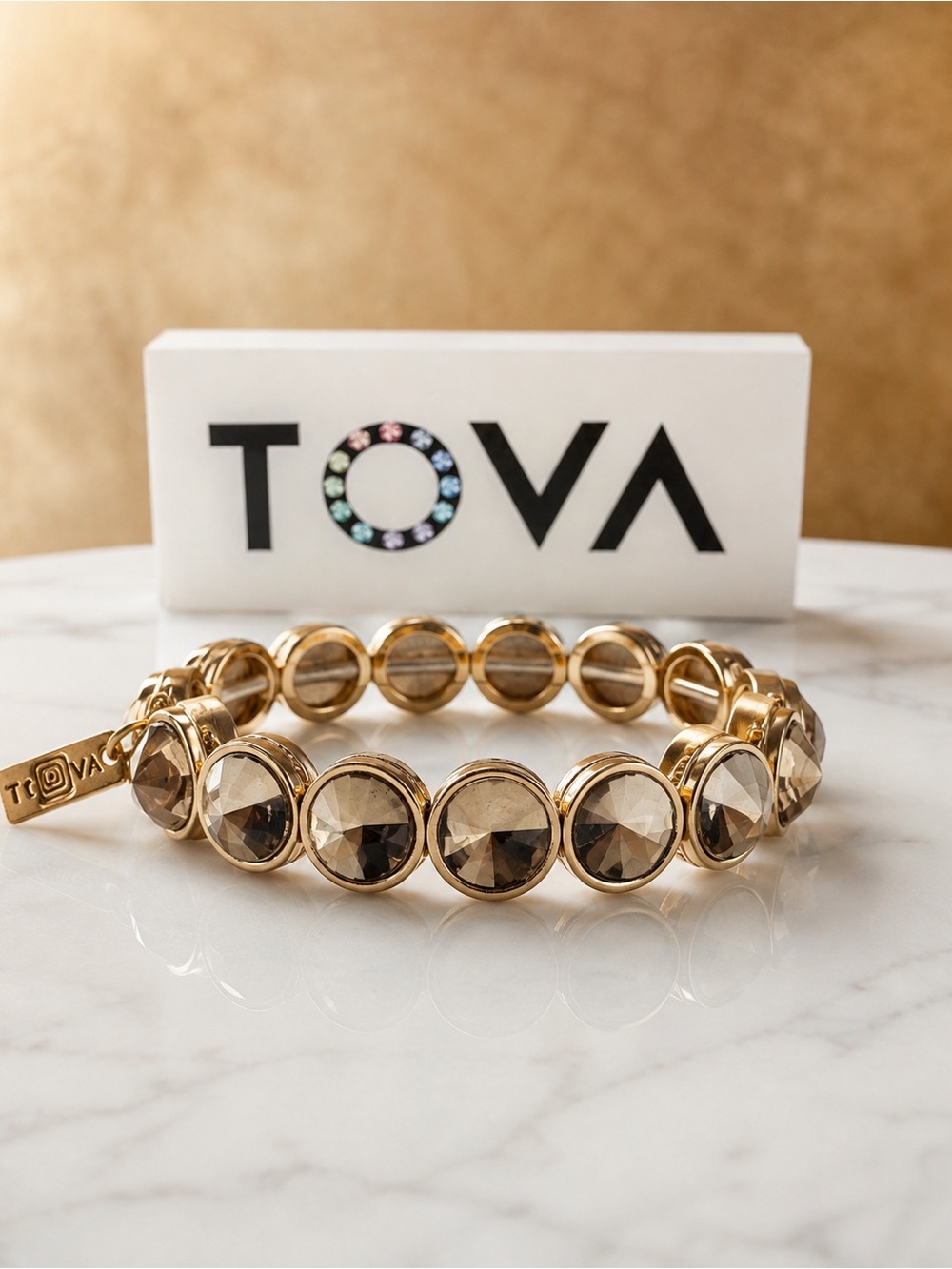 TOVA CROATIA Stretch Gold with 
Smoky brown neutral Crystals.